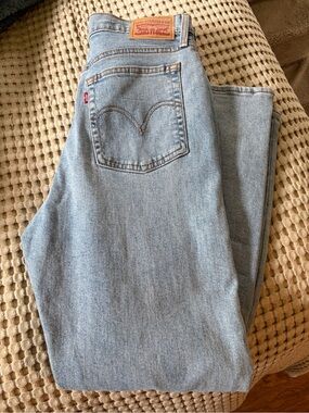 Levi's Light Blue Denim Jeans with Copper Stitching and Interior Tags